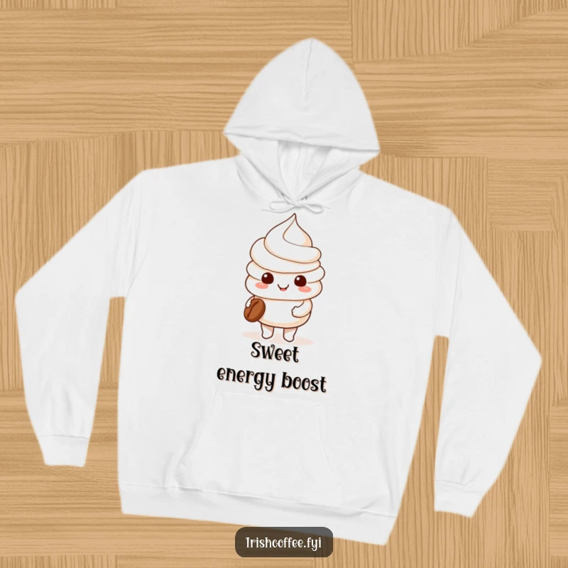 Funny smiling whipped cream character holding a coffee bean on a cozy hoodie, offering warmth and sweet coffee vibes.